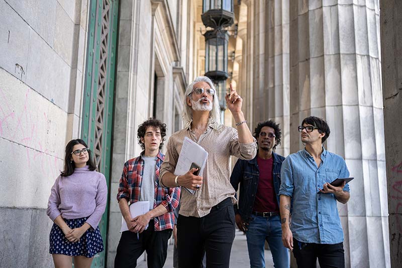 students walking with professor